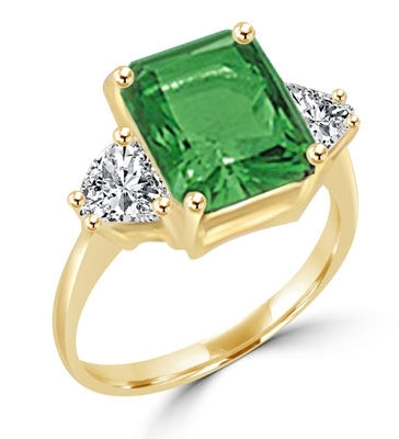ring with 5 ct emerald stone and trilliant baguettes