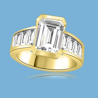 Escape with this Wide Band Ring with Channel Set Emerald Essence, 2.5 cts., separated by straight Diamond Bright Baguettes set vertically for a totally magnificent effect. 3.5 cts. T.W. set in 14K Solid Yellow Gold.