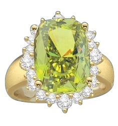 Ring with a oval cut 8.0 cts. Diamond Essence Peridot at the center, surrounded by round Diamond Essence stones, 9.0 cts.T.W. set in 14K Solid Yellow Gold.