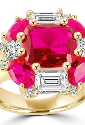 Ring emerald cut and oval cut ruby stones with baguettes