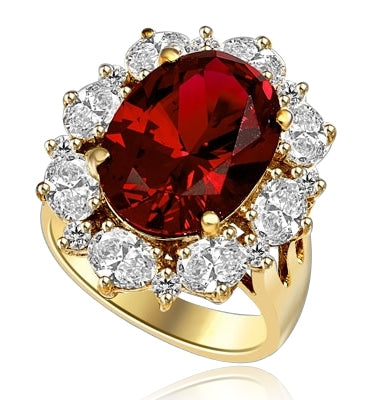 Gorgeous Ring with 8.25 Cts. Oval Cut Ruby Essence in center, surrounded by Oval cut Diamond Essence and Round Brilliant Melee. 10.25 Cts T.W. set in 14K Solid Yellow Gold.