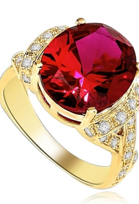 Ruby Ring- 6.0 Cts Oval Cut Ruby Essence in center accompanied by Melee on the band making criss cross design. 6.50 Cts. T.W. set in 14K Solid Yellow Gold.