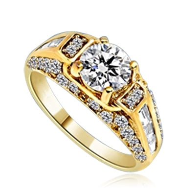 Engagement Ring- 1.0 Ct. round Brilliant Diamond Essence in center with Chanel set Baguettes and Melee going half way down the band. 2.0 Cts. T.W. set in 14K Solid Yellow Gold.