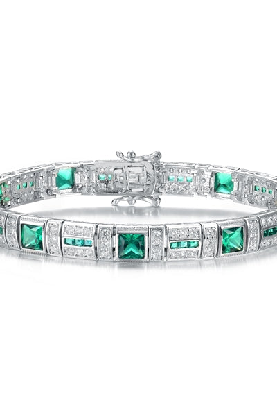 A stunner, this Platinum Plated Sterling Silver 7.25" bracelet features nine princess emerald stones, 0.25 cts each, joined by melee. 17.0 cts. T.W.