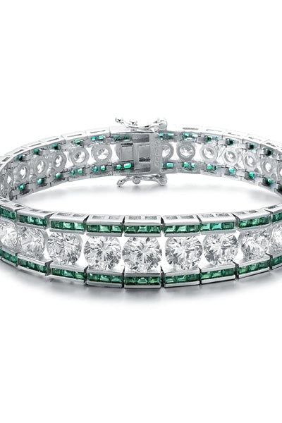 A stunner, this Platinum Plated Sterling Silver 7.25" bracelet features graduating round brilliant stones, emerald baguettes at the top and the bottom. 30.0 cts. t.w.