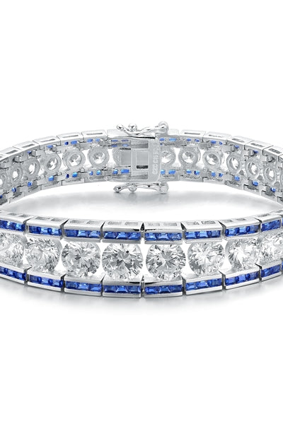 A stunner, this Platinum Plated Sterling Silver 7.25" bracelet features graduating round brilliant stones, sapphire baguettes at the top and the bottom. 30.0 cts. t.w.