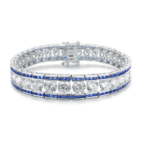 A stunner, this Platinum Plated Sterling Silver 7.25" bracelet features graduating round brilliant stones, sapphire baguettes at the top and the bottom. 30.0 cts. t.w.