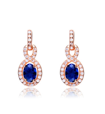 Designer Earring with 1.0 CT Sapphire Essence in the center. Round brilliant melee on the bail and surrounding center stone with interwined design. 2.75 cts.t.w. in Rose Plated Sterling Silver. ( Matching Pendant item# SEC6600SR)
