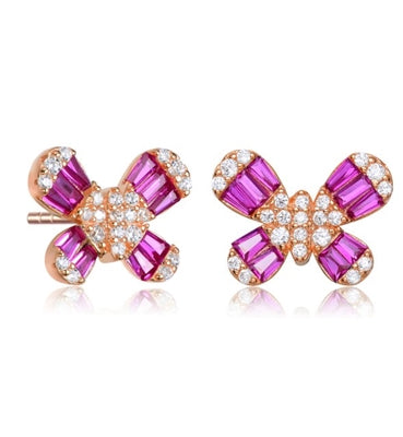 Diamond Essence Butterfly Stud Earrings With Ruby Baguettes and Round Melee, 2.10 Cts.t.w. set in Rose Plated Sterling Silver.
10mm Length x 13mm Width.