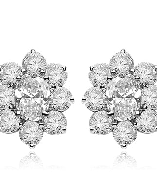 Flower Cluster - Each Earring with 1.0 Cts. Oval Center surrounded by Round Diamond Essence, 4.0 Cts. T.W. set in Platinum Plated Sterling Silver.