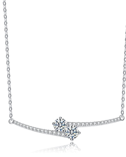 Diamond Essence U & ME Necklace, with two Round Brilliant stone set in four prongs in close connection, supported by melee on the sides. 2.25 Cts.T.W. in Platinum Plated Sterling Silver. Perfect for any occasion.