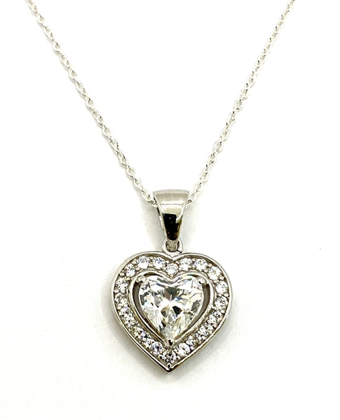 Diamond White Essence stone in prong setting, is surrounded by round brilliant Diamond Essence stones, making another heart. 2.5 cts.t.w. in Platinum Plated Sterling Silver.