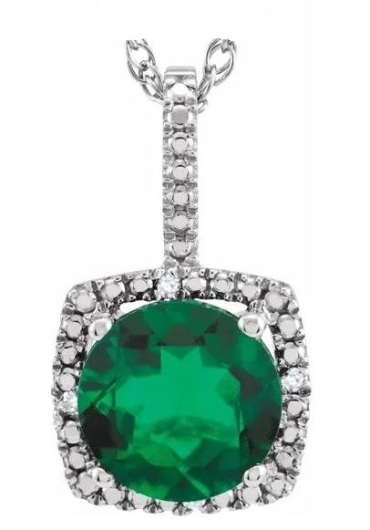 Designer Pendant With Emerald Essence Round cut stone in four prongs setting and surrounded by Diamond Essence Melee,1.50 Cts.T.W. in Platinum Plated Sterling Silver.