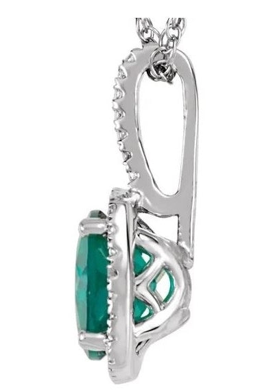 Designer Pendant With Emerald Essence Round cut stone in four prongs setting and surrounded by Diamond Essence Melee,1.50 Cts.T.W. in Platinum Plated Sterling Silver.