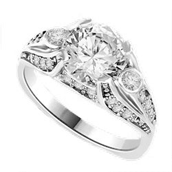 Diamond Essence Designer Ring with 2.0 Cts. Round Diamond Essence in center and melee on each side, 2.5 Cts. T.W. set in Platinum Plated Sterling Silver.