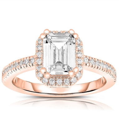 Traditional Emerald Essence, 1.75 ct set in eight prongs setting and outlined with Diamond Essence melee. 2.50 cts.t.w. in Rose Plated Sterling Silver.
