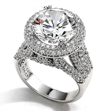 Diamond Essence Cocktail Ring with 6 Ct. Round Brilliant Stone, surrounded by Brilliant Melee, 7 Cts.T.W. in Platinum Plated Sterling Silver.