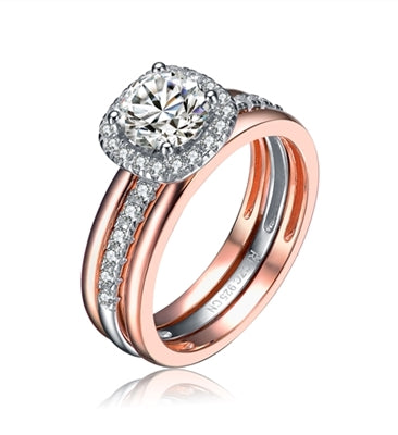 Diamond Essence Designer Ring in two tone. Center band with the Round Brilliant 1carat,surrounded by Diamond Essence melee.1.25 Cts. T.W. in Platinum Plated Sterling Silver & Rose gold plated over Sterling Silver. Ring with a detachable ring guard.