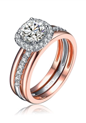 Diamond Essence Designer Ring in two tone. Center band with the Round Brilliant 1carat,surrounded by Diamond Essence melee.1.25 Cts. T.W. in Platinum Plated Sterling Silver & Rose gold plated over Sterling Silver. Ring with a detachable ring guard.