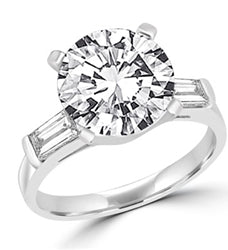 Sterling silver ring with 3 ct stone in center & baguettes