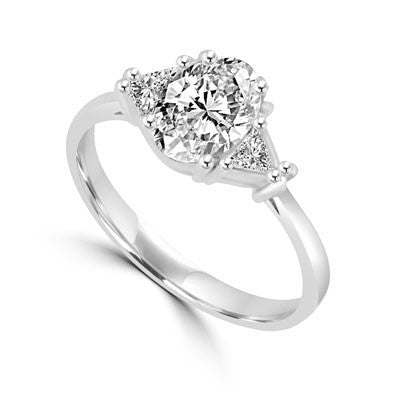 Stunning Ring, 2 Cts. T.W, with 1 Ct Oval Cut Emerald Center and White Trilliant Diamond Essence Stones on side, in Platinum Plated Sterling Silver.