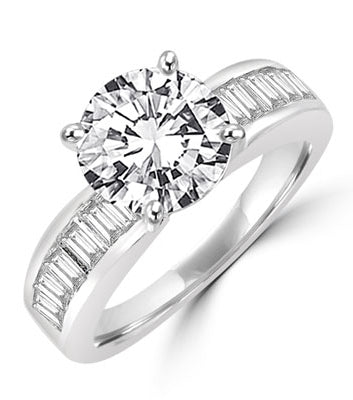Diamond Essence Ring with 2.0 ct. Round Diamond Essence center with channel set baguettes on each side,2.5 ct. tw.in Platinum Plated Sterling Silver.