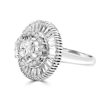 Ring round stone encircled by baguettes