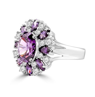 This designer ring is just perfect for party lovers to show-off. 3.0 ct. oval cut amethyst, surrounded by 8 small amethyst marquise,1.3 cts.and white round stones 0.80 cts. all around it, 5.10 cts T.W. set in Pltinum Plated Sterling Silver.