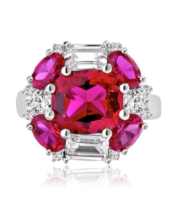 emerald cut and oval cut ruby stones with baguettes in silver ring