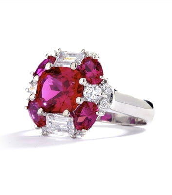 emerald cut and oval cut ruby stones with baguettes in silver ring
