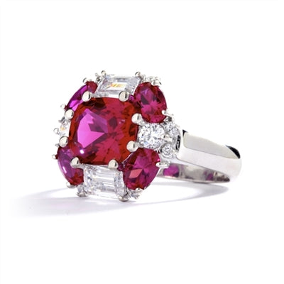 emerald cut and oval cut ruby stones with baguettes in silver ring