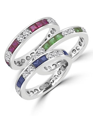 Best selling Eternity Bands with Princess Cut simulated Emeralds and Round Cut Diamond Essence stones all around the band. 1.5 Cts. T.W, in Platinum Plated Sterling Silver.