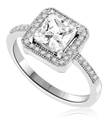 Princess cut Diamond Essence centerpiece,surrounded by Round Brilliant Melee in this pretty Engagement Ring. 2.0 Cts. T.W. set in Platinum Plated Sterling Silver.