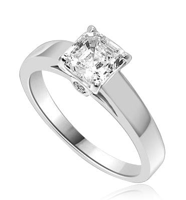Diamond Essence Asscher cut Solitaire Ring artistically set in a wide band with a beautiful accent on both sides to enhance the looks. 1 ct.t.w. in Platinum Plated Sterling Silver.