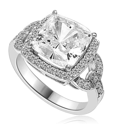 Diamond Essence designer ring 4.0 cts. Cushion cut Diamond essence set high in the center with melee around and on the band. 4.5 cts.t.w in Platinum Plated Sterling Silver.