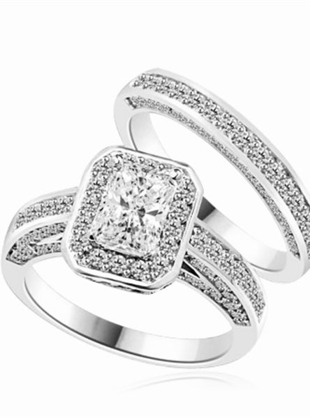 Wedding Set - 1.0 Ct. Radiant Emerald cut Diamond Essence center with Melee around and flowing down the band. Matching band with Melee, 2.75 Cts. T.W. set in Platinum Plated Sterling Silver.