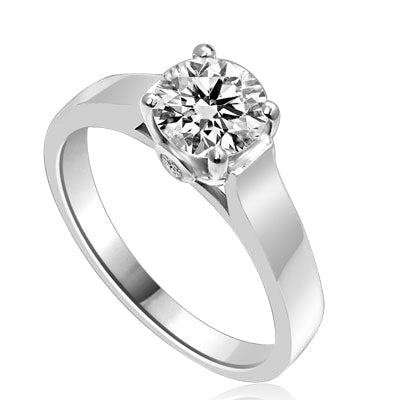 Diamond Essence Solitaire Ring Artistically set in wide band with a beautiful accent on both sides to enhance the looks set in Platinum Plated Sterling Silver.