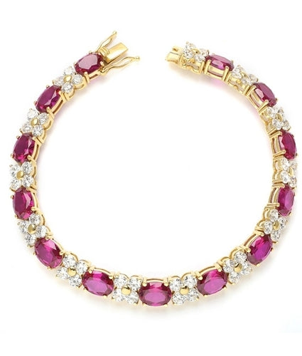 7" long Diamond Essence Designer Bracelet with 1.25 Cts. each Oval cut Ruby Essence and Round Diamond Essence Stones. Appx. 27.0 Cts. T.W. set in 14K Gold Vermeil.