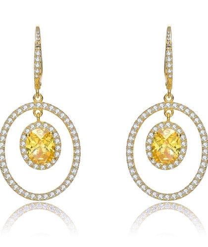 Designer Leverback Earring, with 1.5 carat oval Yellow Citrine Essence surrounded by Round Essence melee, Outlined with bigger oval setting with melee. 5.5 cts.t.w. in Gold Plated Sterling Silver.