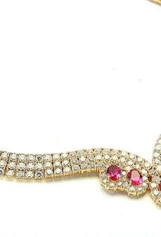 Magnificent Ruby Necklace. 3.0 Cts. Oval cut Ruby Essence in the center and 1.50 Cts. each Ruby Essence encircled by Diamond Essence stones. making 3 rows all around neckline. Special lock- on clasp to secure it. Just perfect to make any day a special day