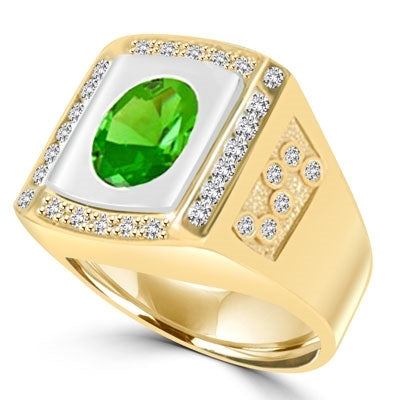 An impresive men's Ring in two-toned 14K Gold Vermeil features a 4.0 cts. Oval Emerald stone set flush in a platform of white gold surrounded by melee, with double jolts of melee on each shank. 4.50 cts. t.w.