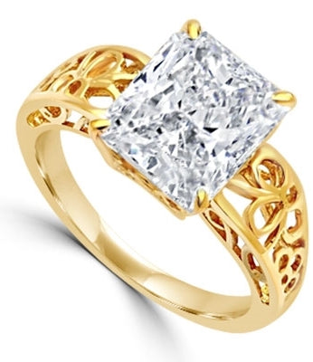 In this finely created ring, a 4 Ct. Radiant Emerald White Brilliant Stone is crafted atop an ethic set wide band. In 14k Gold Vermeil.