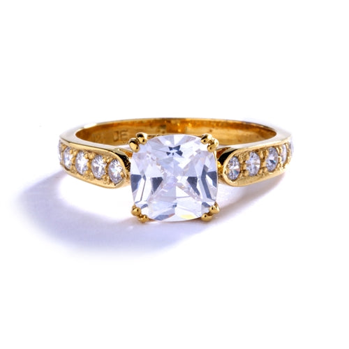 Diamond Essence Ring with 2.0ct. Cushion Cut stone set in eight prongs with round stones on each side, 3.5ct. T.W. set in 14K Gold Vermeil.