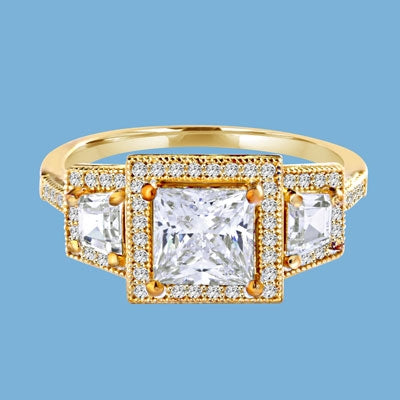Diamond Essence Ring with 1.5ct. Princess Cut stone set in four prongs with baguettes on each side surrounded by round stones, 2.5ct.T.W. set in 14K Gold Vermeil.