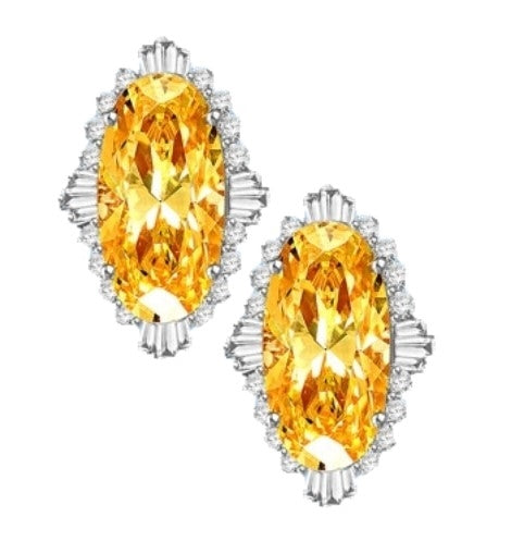 Diamond Essence Earrings in 14k Solid White Gold with Diamond essence 9.0 cts. Canary stone in the center and encircled by round stones and a large spray of baguettes on all four sides. Wear it with confidence. Appx. 21.0 cts. t.w.