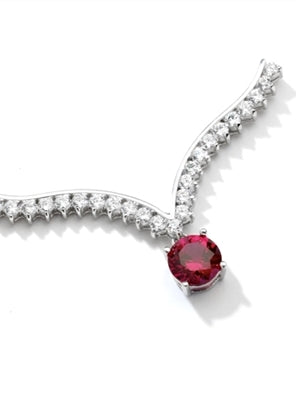 Top of the world - Supreme Necklace that is sure shot eye candy! 2 Ct. Brilliant White Ruby Essence Round Dangler atones a curvy melee of Round Brilliants set exquisitely in an Art Deco Setting! Attached with Chain in 14k Solid White Gold.