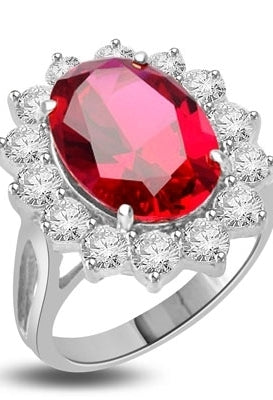 Princess Ring with 6.0 Cts. Oval cut Ruby Essence center surrounded by 14 Round Brilliant Diamond Essence stones 6.50 Cts. T.W. set in 14K Solid White Gold.