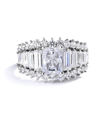 Emerald cut round radiating stone in white gold