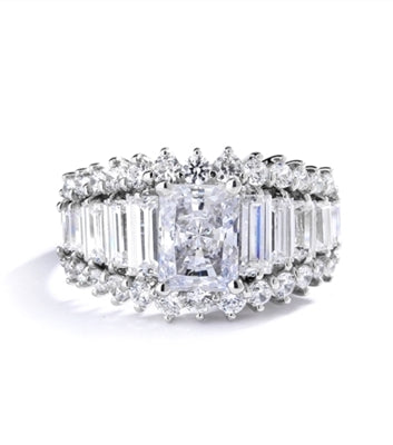Emerald cut round radiating stone in white gold