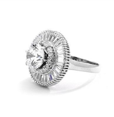 Ring round stone encircled by baguettes